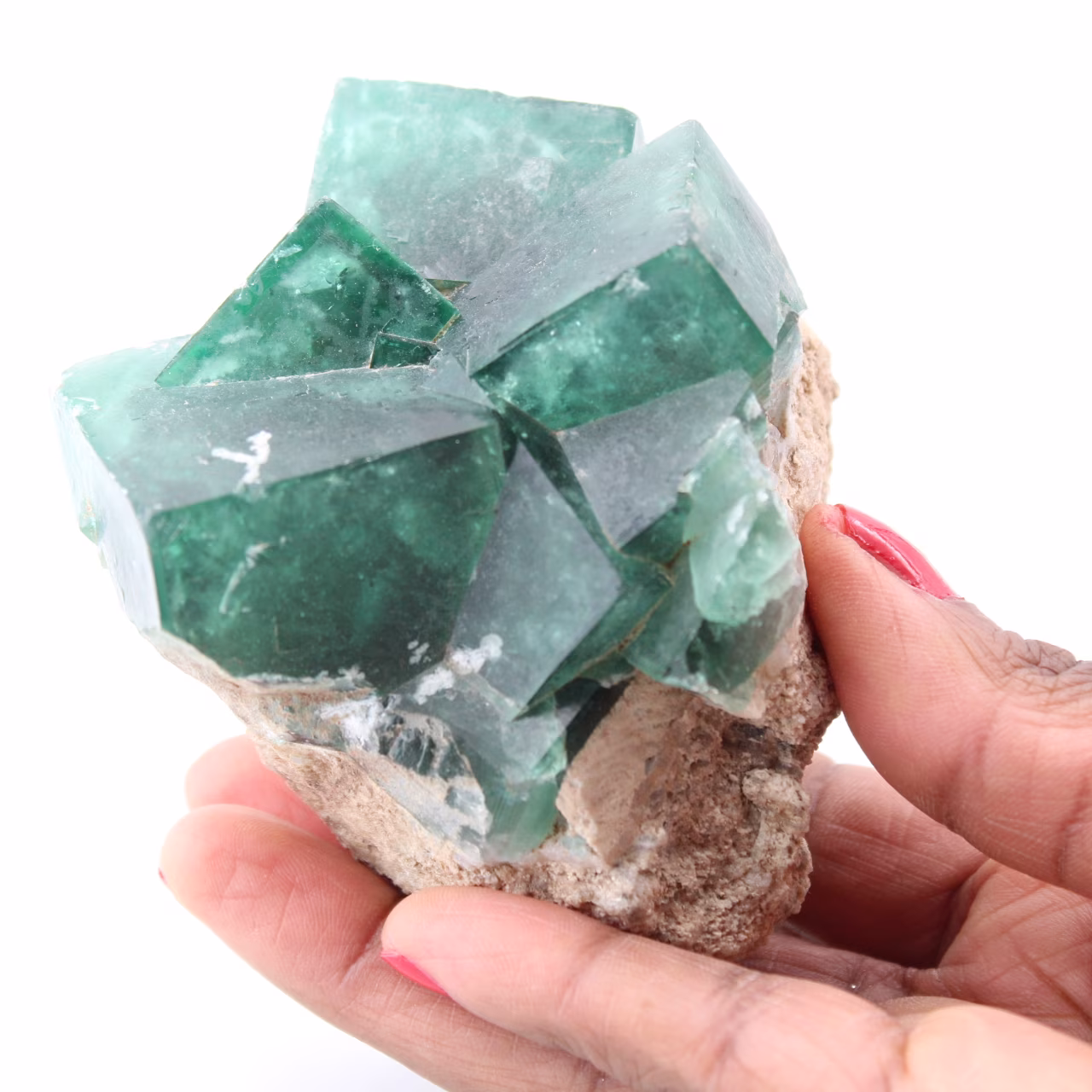 Cristales cúbicos de fluorita verde sobre fluorita masiva