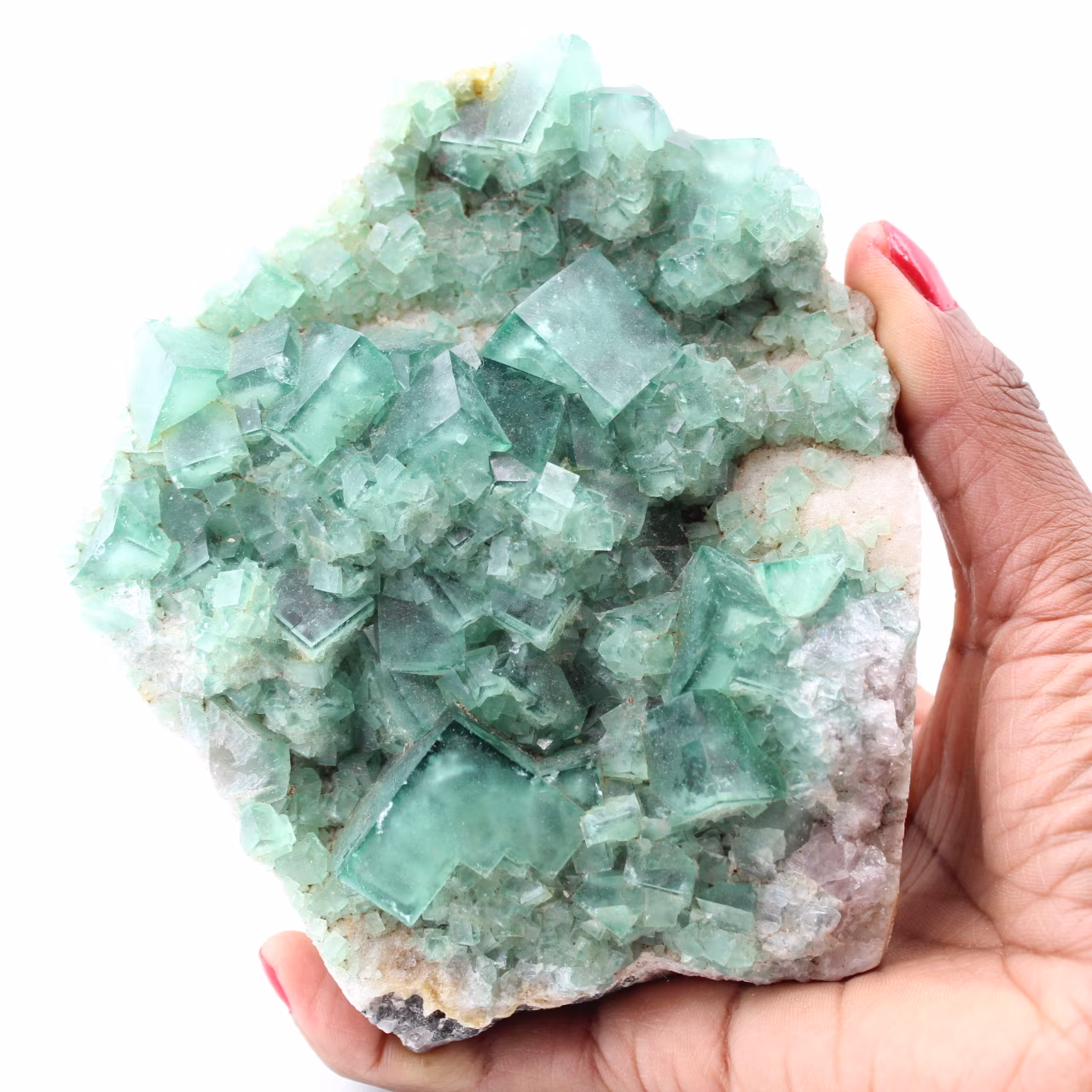 Cristales cúbicos de fluorita verde sobre fluorita masiva